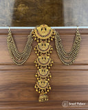 Gold necklace and earrings set on a wooden surface with 'Jewel Palace' branding.