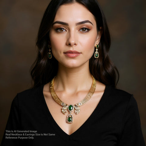 Woman wearing a gold necklace and earrings with green gemstones against a dark background