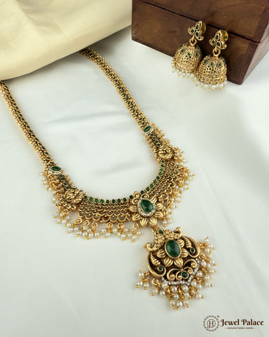 Gold necklace with green stones and matching earrings on a white background, branded 'Jewel Palace'.
