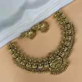 Gold necklace on a mannequin with a white background