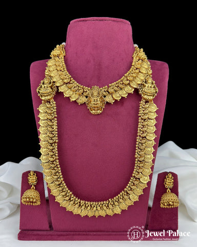 Gold necklace and earrings on a pink stand with 'Jewel Palace' branding.