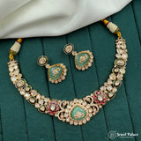 Ornate necklace and earrings set on a green surface with 'Jewel Palace' branding.