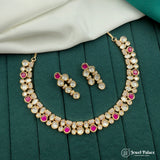 Jewelry set with necklace and earrings on a green surface, brand 'Jewel Palace' visible.