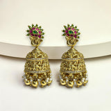 Gold earrings with green and red gemstones on a white background