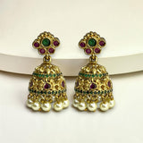Gold earrings with pearls and gemstones on a white background