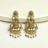 Ornate gold earrings with pearls and gemstones on a white background