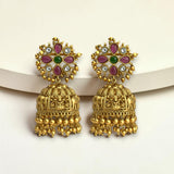 Gold earrings with colorful gemstones on a white background