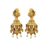 Pair of gold earrings with intricate designs on a white background