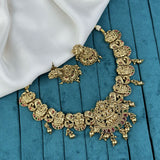 Gold necklace and earrings on a blue fabric background