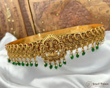 Gold and green decorative headband on a white fabric background with 'Jewel Palace' branding.