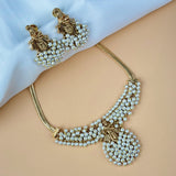 Pearl necklace and earrings on a mannequin