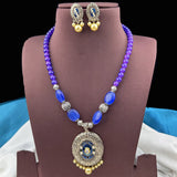 Jewelry set with necklace and earrings on a brown stand