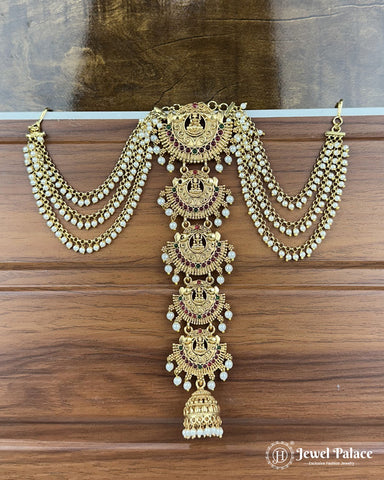 Gold necklace with pearl details on a wooden background, brand 'Jewel Palace' visible.