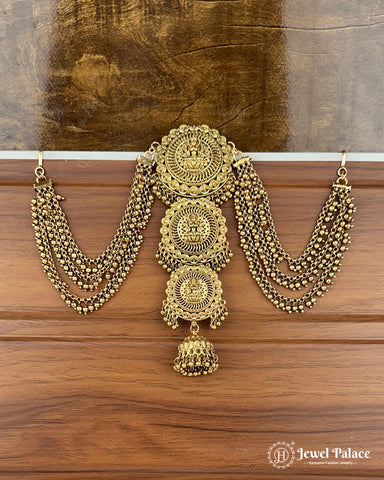 Gold necklace with intricate designs on a wooden surface, branded 'Jewel Palace'.