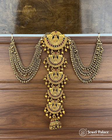 Gold necklace and earrings set on a wooden surface with 'Jewel Palace' branding.