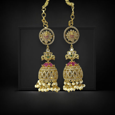 Gold earrings with gemstones on a black background