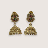 Gold earrings with gemstones on a light gray background