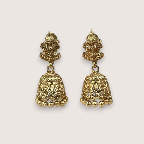 Pair of gold earrings on a white background