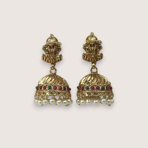 Pair of gold earrings with pearls and gemstones on a white background
