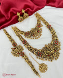 Gold jewelry set with red stones on a white and red fabric background, featuring 'Jewel Palace' branding.