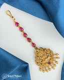 Gold pendant with red gemstones on a blue and white fabric background, featuring the brand 'Jewel Palace'.