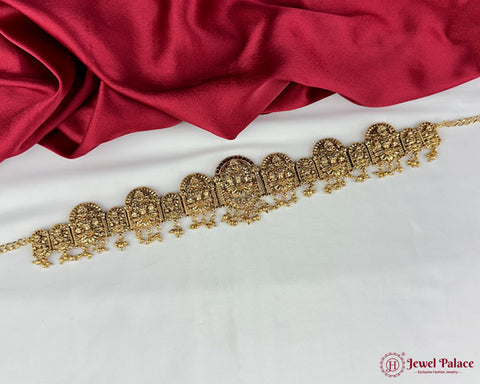 Gold bracelet on a white and red fabric background with 'Jewel Palace' branding.