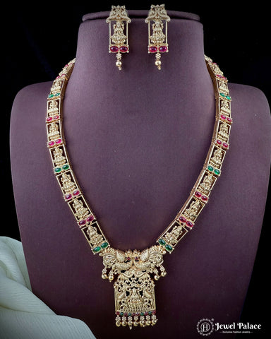 Jewelry set with necklace and earrings on a purple stand, brand 'Jewel Palace' visible.