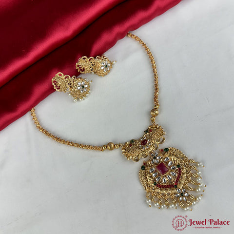 Gold necklace and earrings set on a red and white fabric background with 'Jewel Palace' branding.