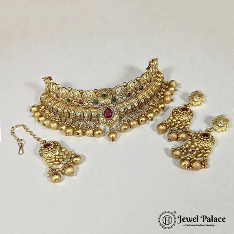 Gold jewelry set with necklace, earrings, and bracelet on a white background, branded 'Jewel Palace'.