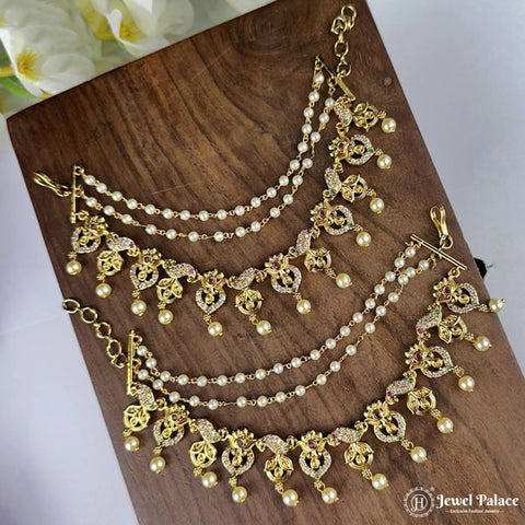 Gold and pearl necklace on a wooden surface with 'Jewel Palace' branding.