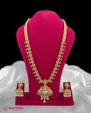 Gold necklace and earrings set on a pink stand with 'Jewel Palace' branding.