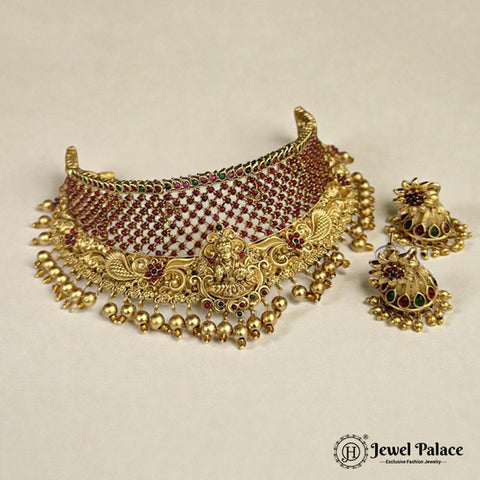 Gold necklace with matching earrings on a beige background, featuring 'Jewel Palace' branding.