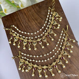 Gold and pearl jewelry set on a wooden surface with 'Jewel Palace' branding.