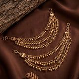 Gold-toned multi-strand chain belly/chest chain with small bead details, displayed on draped brown fabric with a textured wood prop.