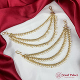 Gold and pearl necklace on a red and white fabric background with 'Jewel Palace' branding.