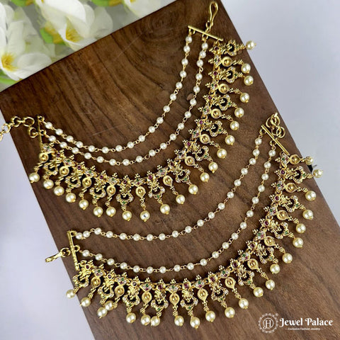 Gold and pearl necklace on a wooden surface with 'Jewel Palace' branding.