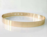 Gold metal ring on a white background