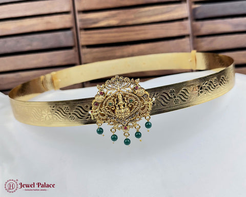 Gold headband with decorative element on a white surface, brand 'Jewel Palace' visible