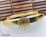 Gold headband with decorative elements on a wooden background