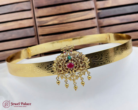 Gold headband with decorative elements on a wooden background
