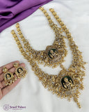 Gold necklace with intricate designs held by a hand on a white background, with 'Jewel Palace' branding.