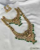 Gold necklace with green beads and matching earrings on a white fabric background, branded 'Jewel Palace'.