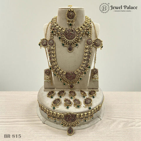 Ornate gold jewelry set on a mannequin bust with 'Jewel Palace' branding.