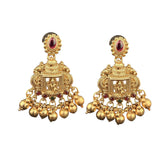 Pair of gold earrings with red gemstones on a white background
