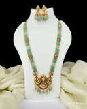 Green and gold necklace with matching earrings on a white mannequin bust, branded 'Jewel Palace'.