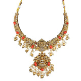 Gold necklace with red stones on a white background