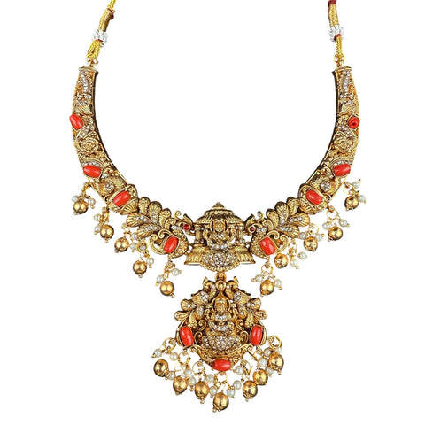 Gold necklace with red stones on a white background