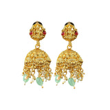 Gold earrings with green and red stones on a white background