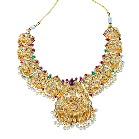 Gold necklace with gemstones on a white background