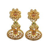 Pair of gold floral earrings on a white background
